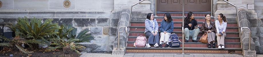 five-students-sitting-on-steps.jpg