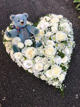 White Floral Heart with small teddy bear.