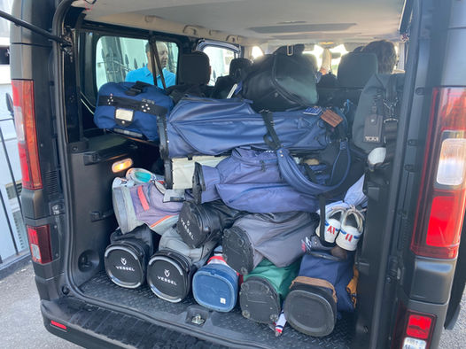 Internal shot of 7 seater vehicle showing spacious boot space. Packed with golfing equipment and luggage