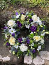 Purple & White Circular floral wreath.