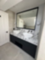 Modern bathroom renovations in London showing marble vanity.
