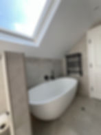 Modern bathroom renovations in London with freestanding tub