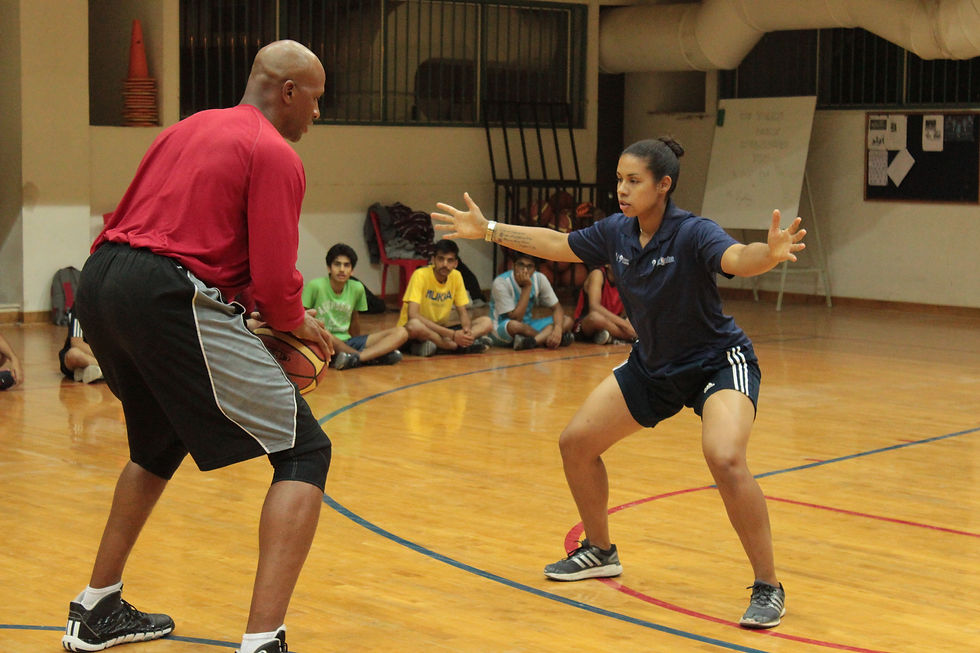 Coach Sydney showing proper defensive stance.JPG