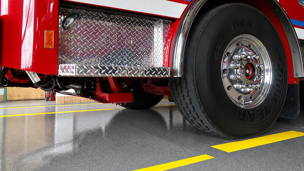 Fire station featuring a durable epoxy flooring system with a high-wear urethane topcoat installed by Gulf Atlantic Floor Systems to withstand emergency vehicle traffic, impacts, and daily operations.