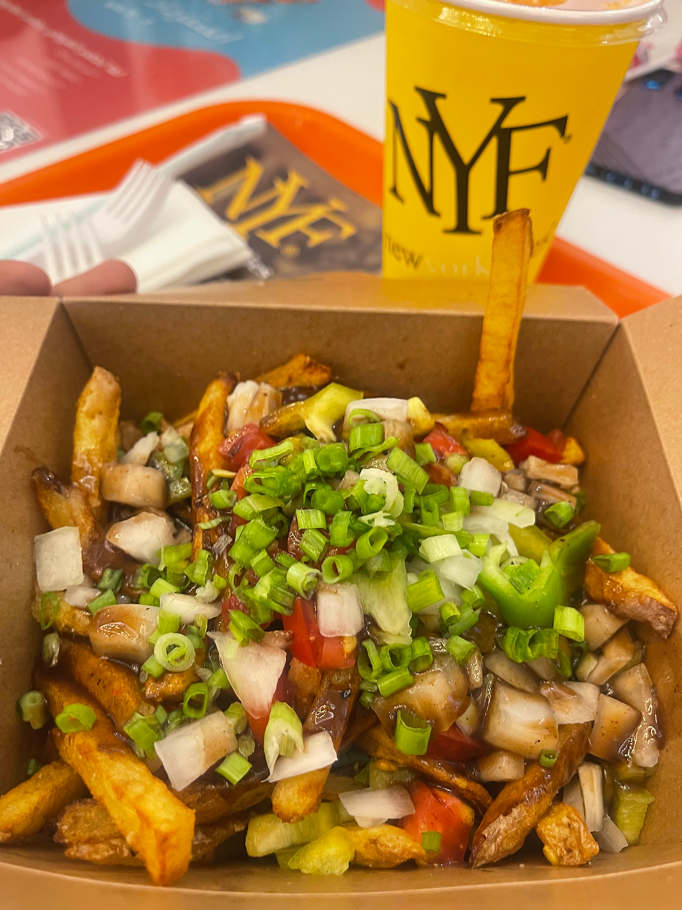 Close-up view of Imli Fries topped with herbs and spices