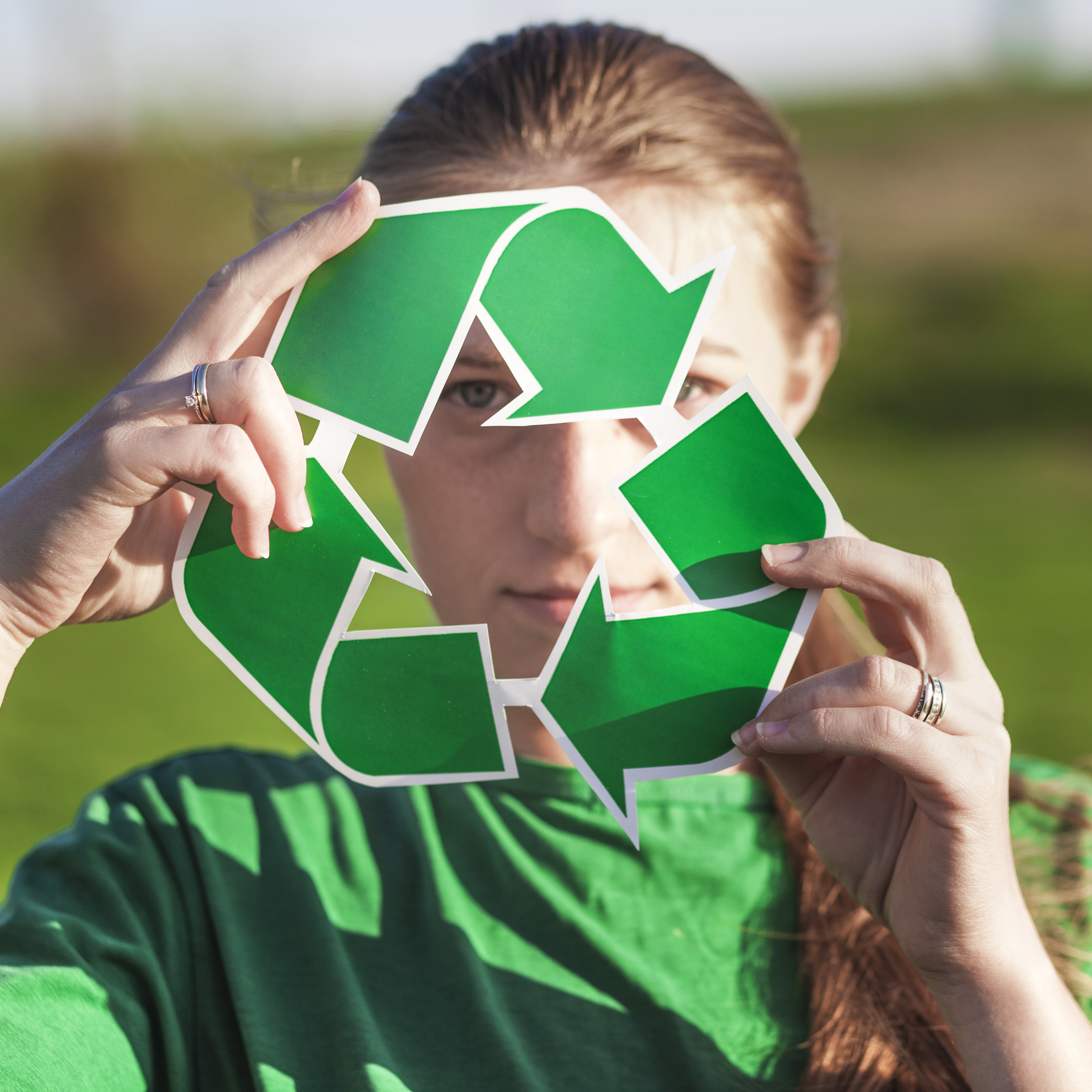 recycle-background-with-woman-holding-recycle-sign.jpg