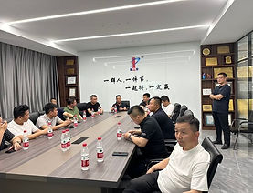 Business meeting in a modern conference room: Company team discusses heavy-duty truck axle parts solutions.