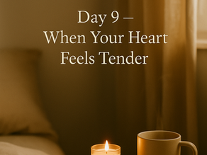 A softly lit bedroom scene with warm morning light, showing a bedside table holding a glowing candle and a beige mug, with the text ‘Day 9 — When Your Heart Feels Tender’ in a gentle serif font.