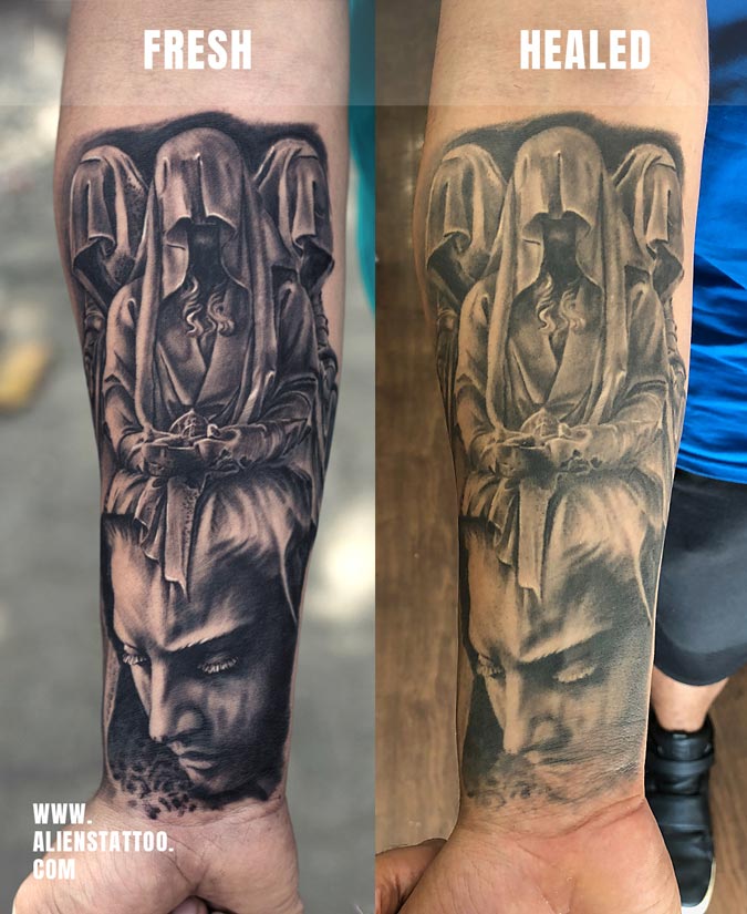 black and grey portrait tattoo