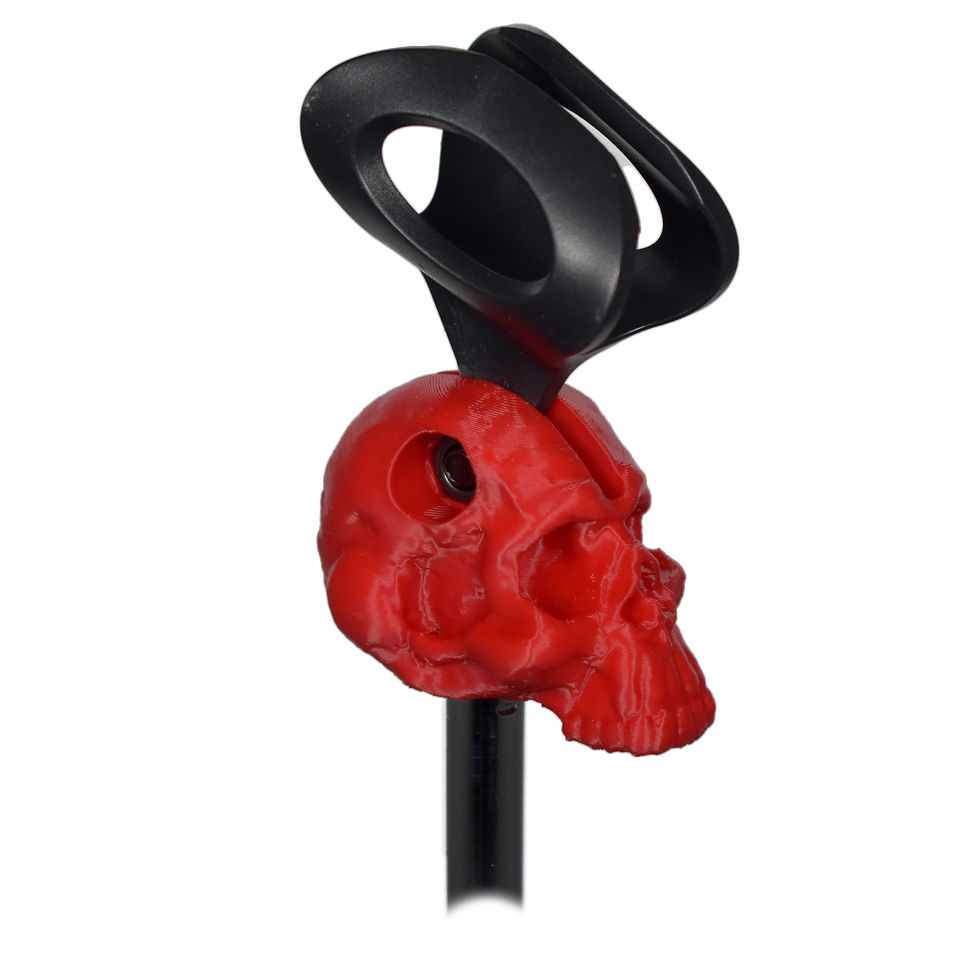 Thumbnail: Universal mic clip, simean skull design. Red. Quarter profile view, no mic