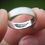 Thumbnail: Matte finished eye of horus ring. Shiny polished inside with feather of maat symbol. Egyptian mythology.