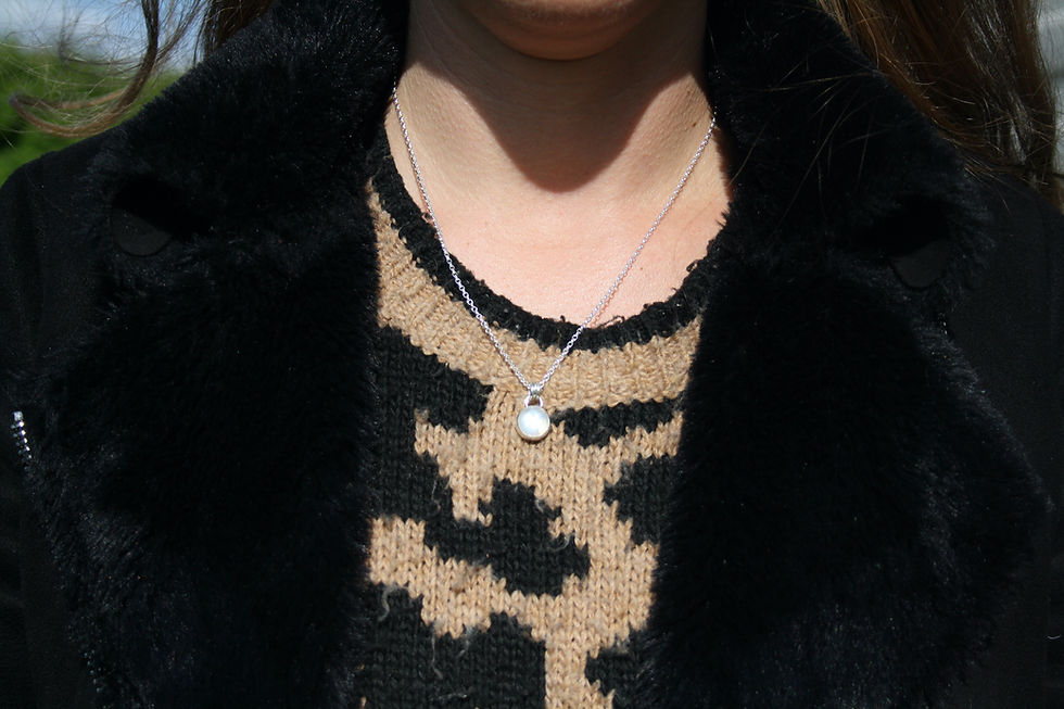 Thumbnail: Small circular moonstone necklace with blue flashes. Crescent moon on back. Eco sterling silver.