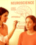 woman having light eye movement therapy with neuroscience information on the wall behind