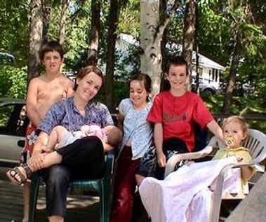 Therapist with baby and family postpartum in Elora