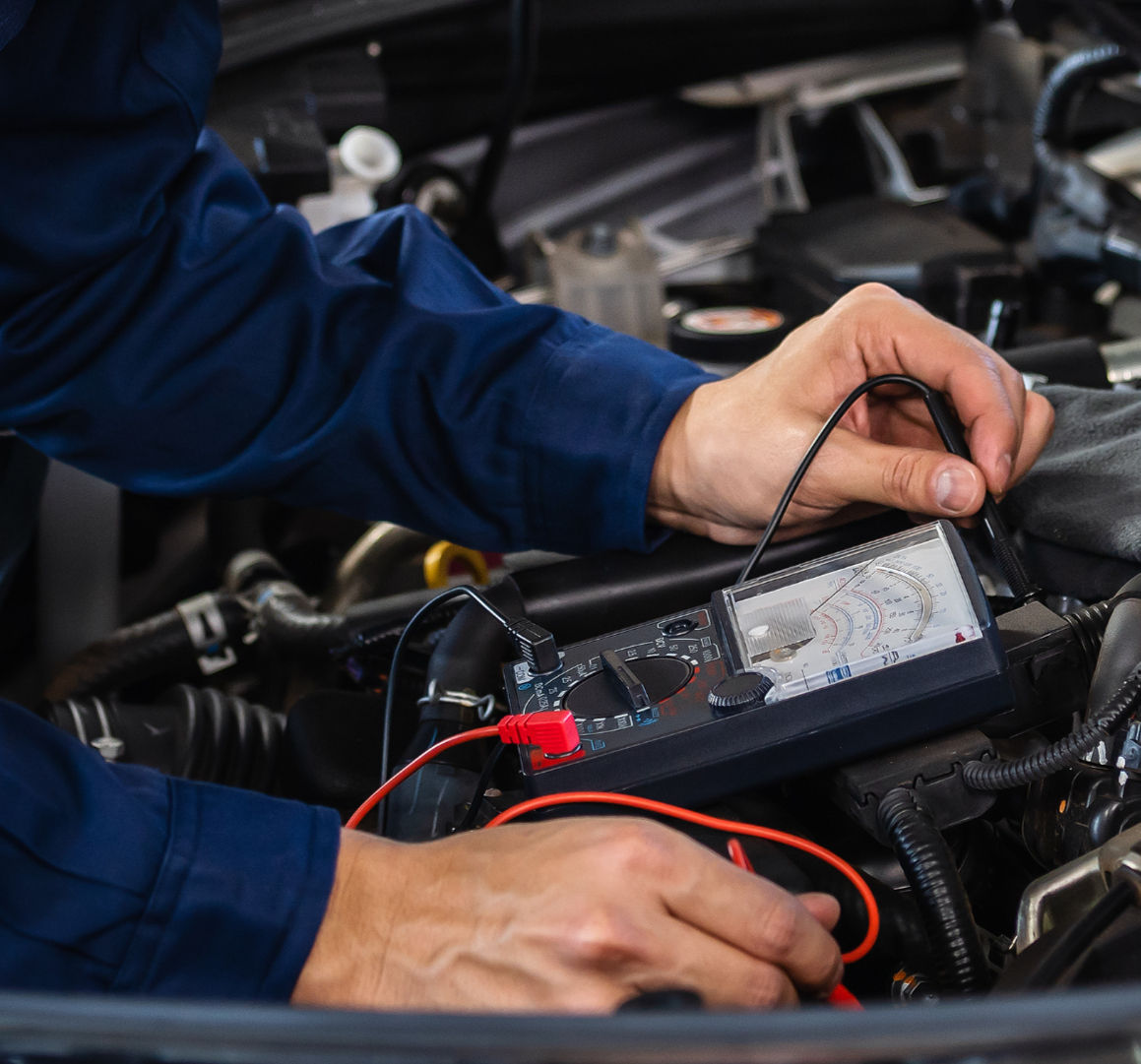 a tech checking the oms of a car