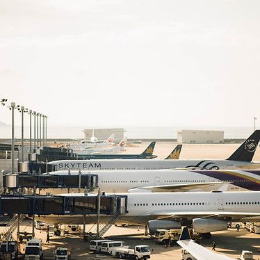 Airplanes at their terminals boarding passengers