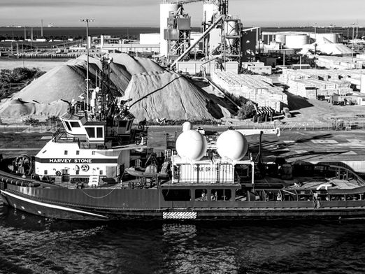 Aerospace support vessel at Port Canaveral with Blue Origin equipment and Florida industrial port infrastructure