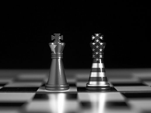 Black and white image of U.S. and China chess pieces representing strategic competition in artificial intelligence policy