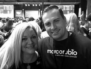 Sebastian Aleksander and Alina Garcia at a 2016 Marco Rubio presidential campaign rally in South Carolina, standing together in a crowded event hall with the stage and campaign signage in the background.