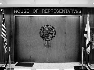 Florida House chamber doors in Tallahassee, where lawmakers are reviewing proposals to eliminate property taxes, expand senior exemptions, and phase out outdated special taxing districts.