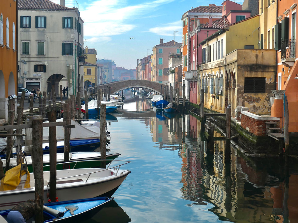 Chioggia canal, bridge and colorful houses