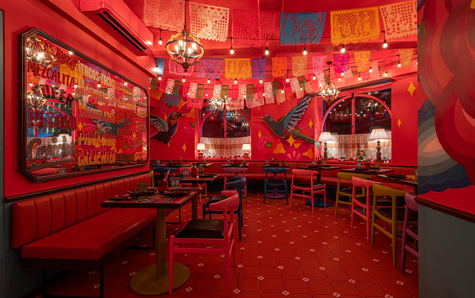 Vintage mirror and Senkoe-inspired hummingbird art inside Mezcalita Bandra’s second level.