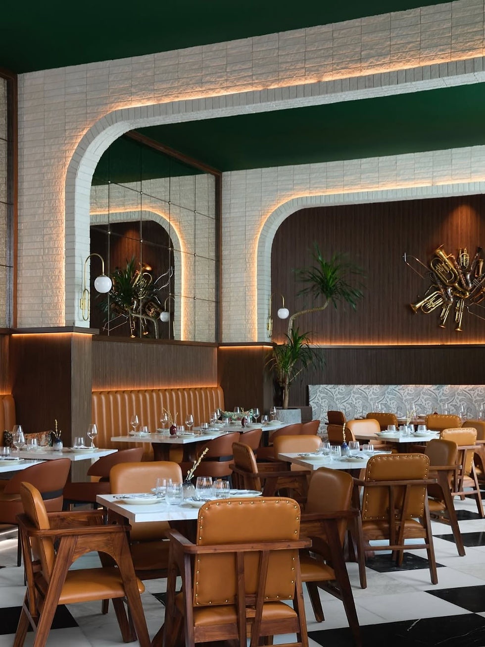 SoBo 20 Marine Drive interiors with Art Deco arches, warm lighting, and tan leather seating.