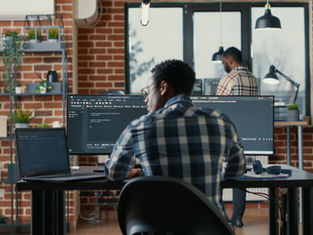 A programmer coding with his agents