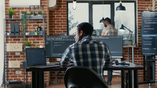A programmer coding with his agents
