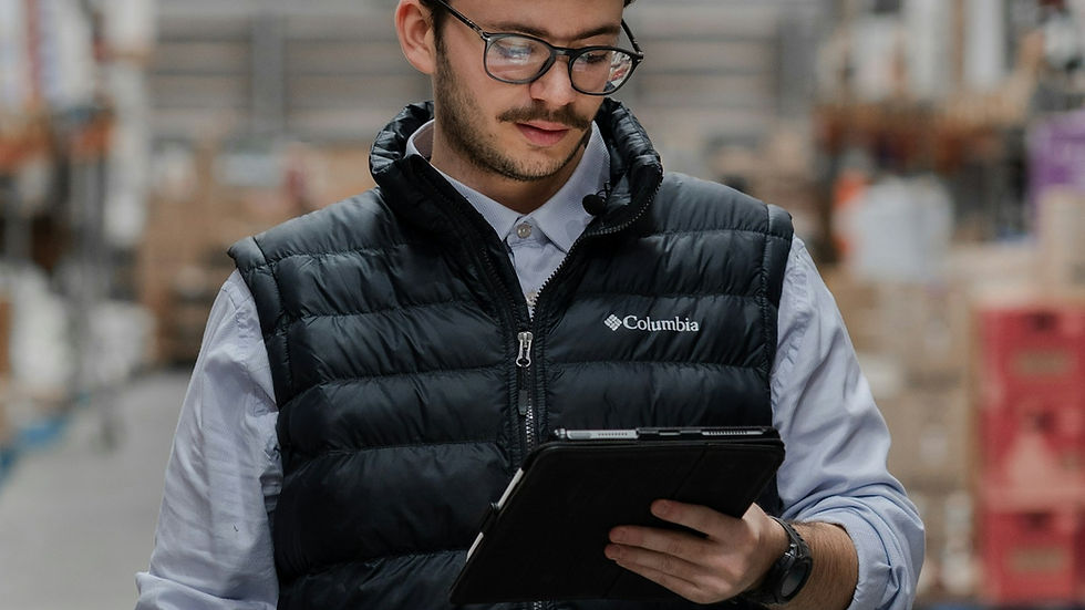 Frontline employee using a tablet in a warehouse