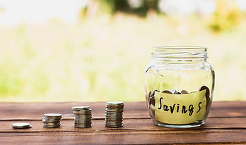 jar-with-savings-coins-stack-table.jpg