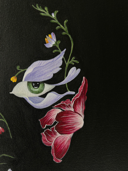 Floral portrait with green eyes against a black background