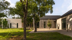 Mid-century modern rustic custom home exterior in Driftwood, Texas