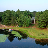 Aerial view of the Meme & Papa's Cabin lakefront area