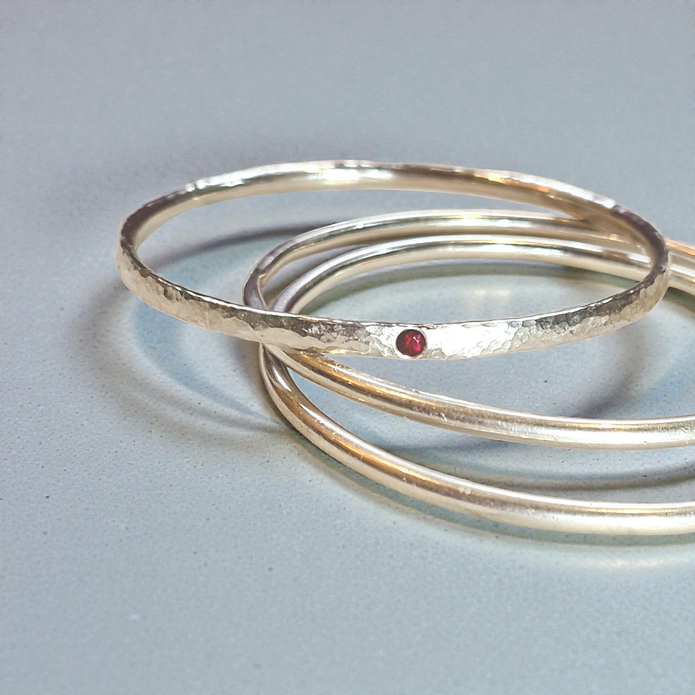 silver bangle with ruby