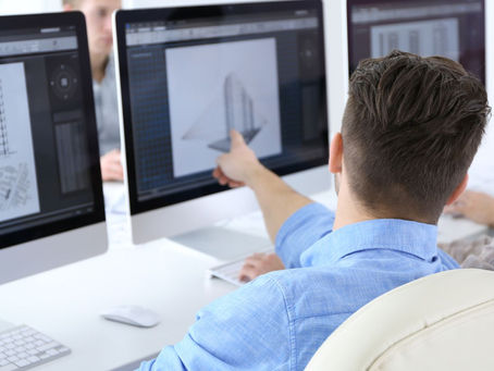 Infrastructure specialist pointing at computer screen