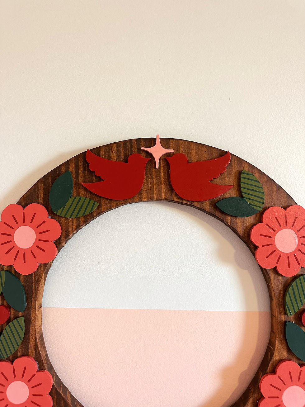 Thumbnail: Wooden frame, red birds, pink flowers, green leaves, white and pink circle.
