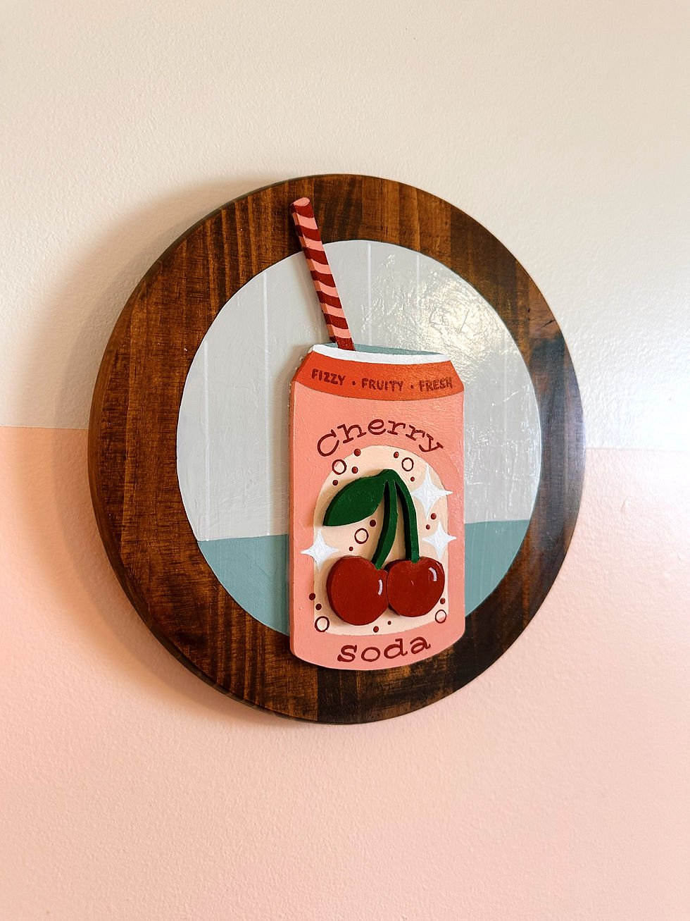 Thumbnail: Decorative wooden sign with pink "Cherry Soda" can and straw.