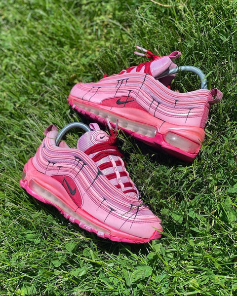 Pink customized pair of Nike Airmax sneakers