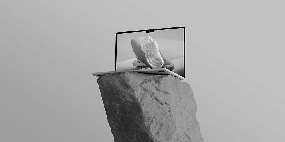 Photo of laptop on top of sculpture