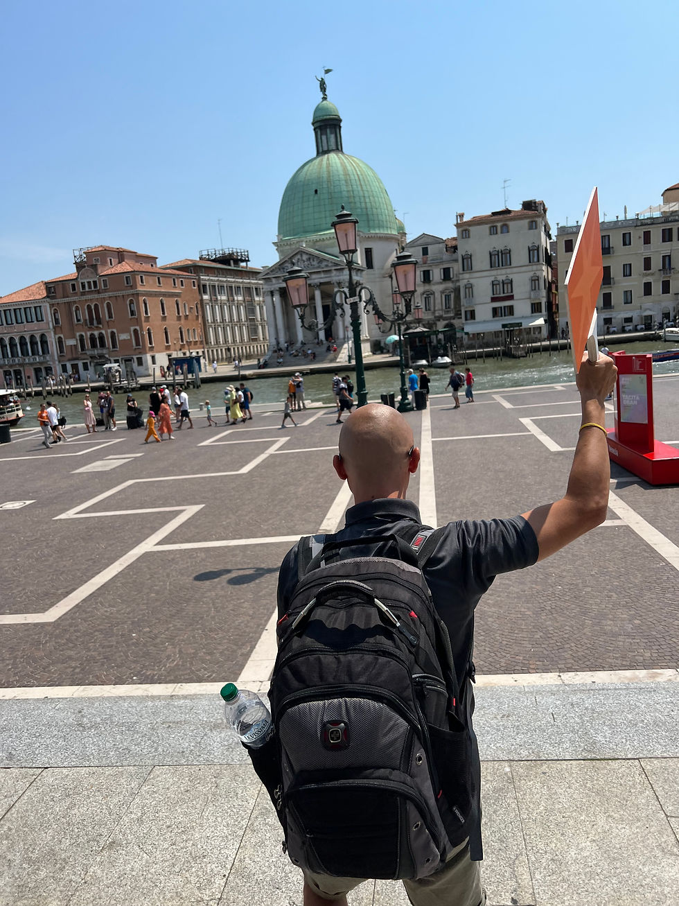 Adventures by Disney guide leading a group in Venice, Italy