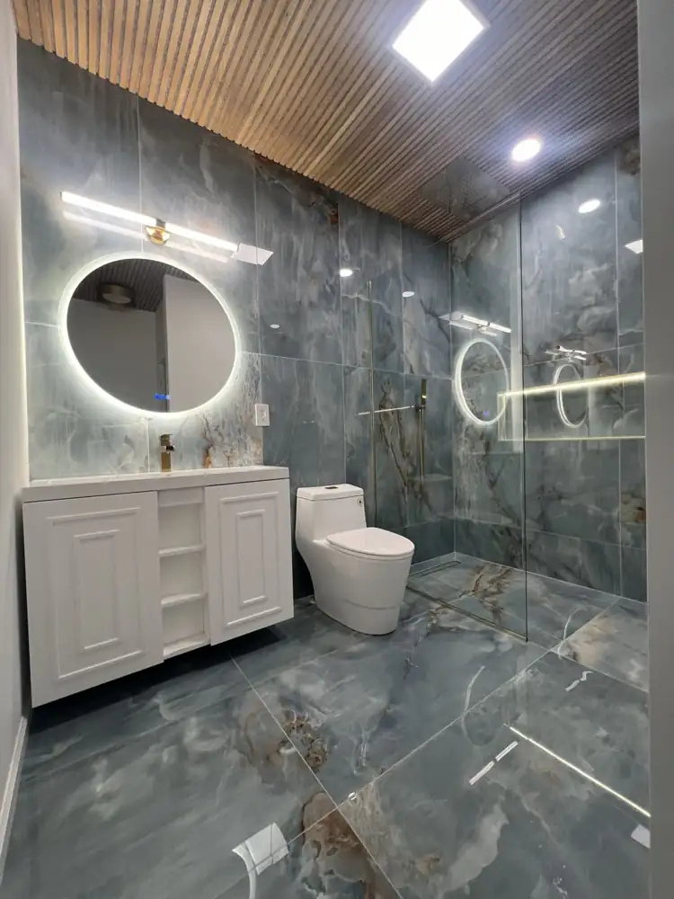 Bathroom after remodel with walk-in shower and onyx-look porcelain, Amherst