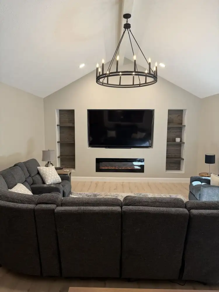 Family room with media wall, electric fireplace and chandelier, Solon
