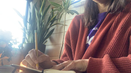 Woman journaling about self-acceptance and personal growth