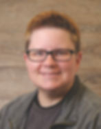Mel Dyjak short hair black glasses smiling