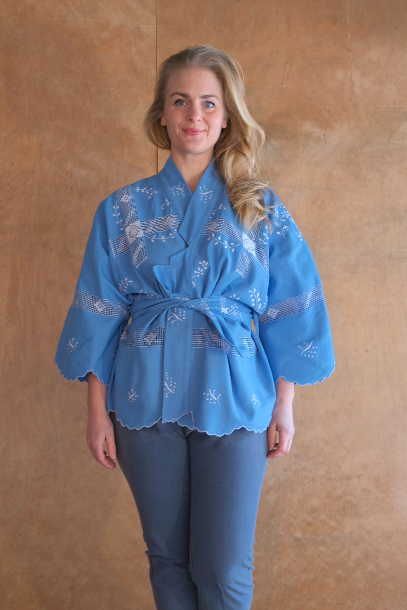 Blue wrapblouse with embroidery and laceparts