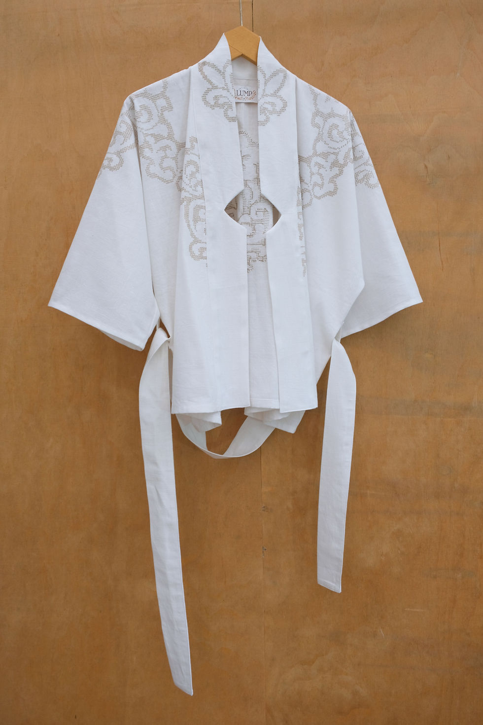 Thumbnail: Wrapblouse with brown cross-stitch embroidery