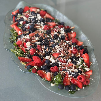 Salad with Brussels sprouts, blueberries, walnuts, and feta on a white plate. Text above reads "BERRIES & BRUSSELS SALAD" on purple.