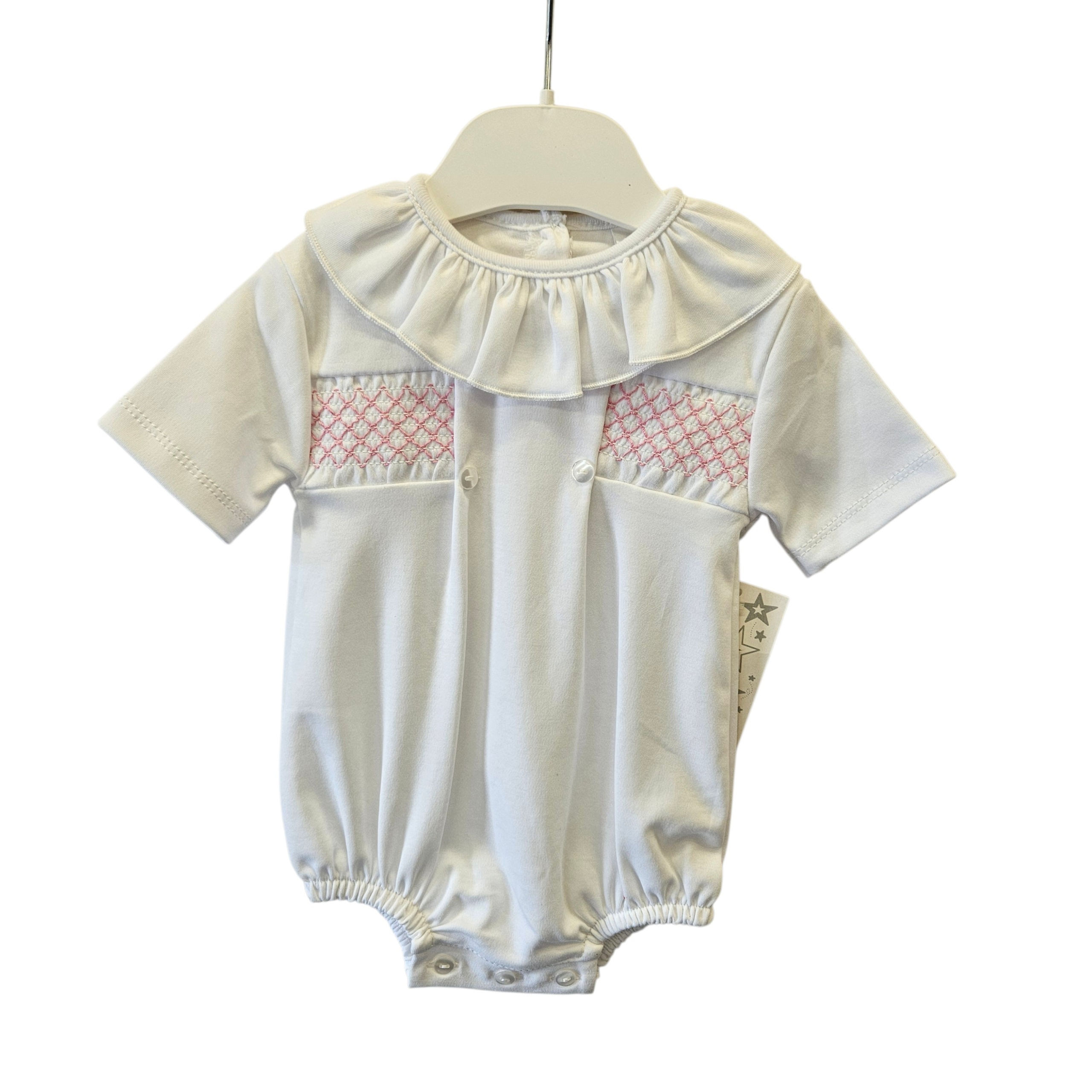 White cotton romper with pink smocking