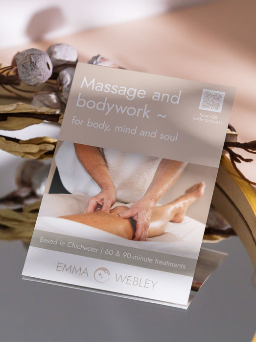 A massage and bodywork flyer on display promoting Emma Webley's services in Chichester.